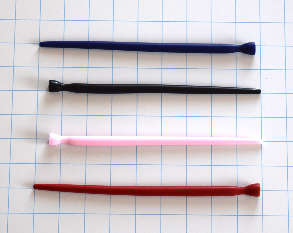 SSND-SMTPR-5-10 tapered silicone urethral sound shown in blue, black, pink, and red variants on a grid background, highlighting the gradual 5mm to 10mm expansion shaft and retention valley flange.