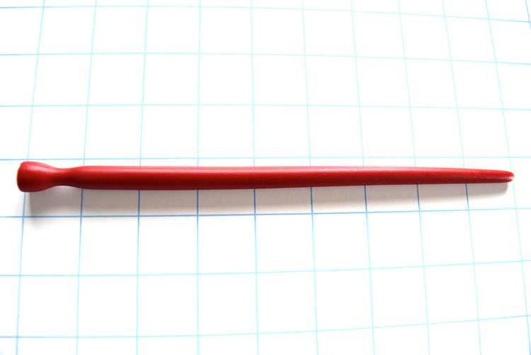 SSND-SMTPR-5-10 smooth elongated red silicone urethral sound shown horizontally on a grid background, displaying its gradual 5mm to 10mm taper, 7mm retention valley, and 12.5mm flared safety base.