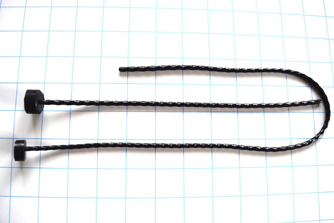 Black spiral-twisted silicone urethral sounds shown in different lengths on a blue grid background.