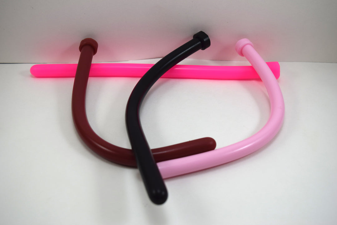 Four 14mm SSND silicone sounds called The Rod arranged together, showing flexible maroon, black, light pink, and bright neon pink options.