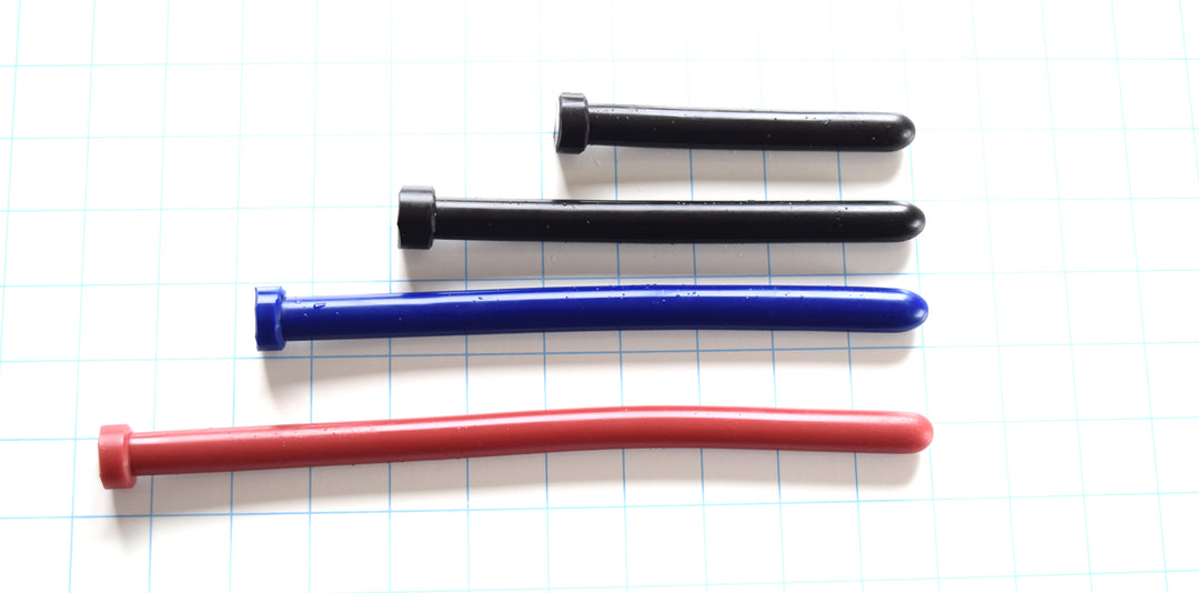 SSND-The Rod 14mm smooth silicone urethral sound showing straight design with consistent diameter, premium silicone construction on a blue grid background.