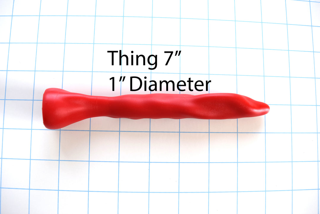 SSND-THING 7-inch silicone urethral sound featuring textured surface bumps, a 1 -inch bulbous tip expansion, and a solid safety flange base.