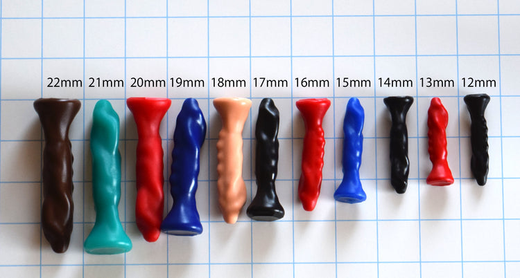 SSND-THING 12mm–22mm oblong silicone urethral sound showing asymmetrical cross-section and flared base.