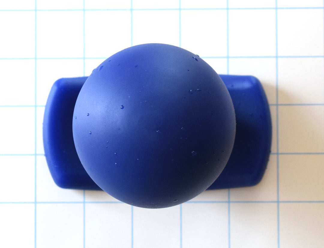 The Orb 3-inch bulb-style silicone retention plug cast in solid royal blue on a white grid background, highlighting the 3-inch maximum diameter sphere and contoured oval gluteal base flange.