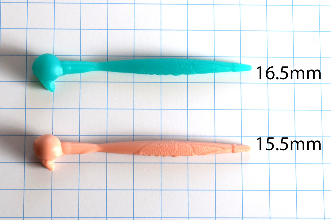 The Ribbit 15.5mm and 16.5mm silicone urethral sounds side by side on a grid background, showcasing the textured frog-skin shaft and bulb details.