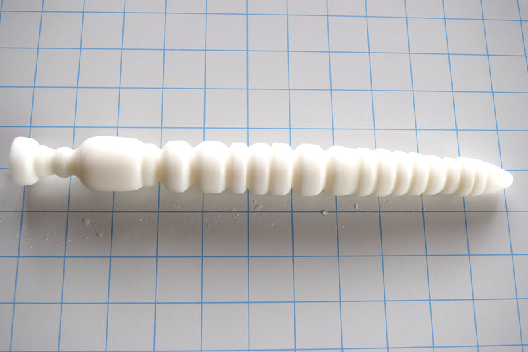 VBE11 The Vibe 11-inch ribbed flexible silicone enema nozzle with 18 sensory ribs and valleys, 1.2-inch maximum diameter, and flange base