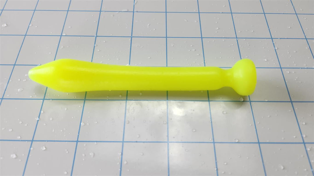 SSND-Slug fluorescent yellow silicone urethral sound featuring a 5.8mm tapered tip, 20mm main bulb, 14.5mm shaft, 10.5mm retention valley, 22.1mm safety flange, and 4.5-inch insertable length on a grid background.